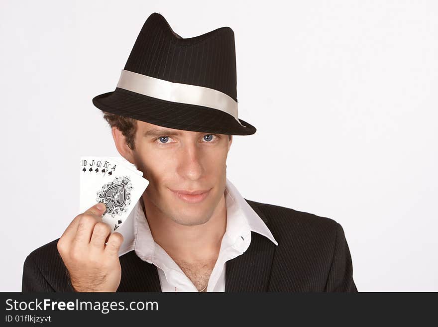 Poker player smirking with winning hand of royal flush. Poker player smirking with winning hand of royal flush