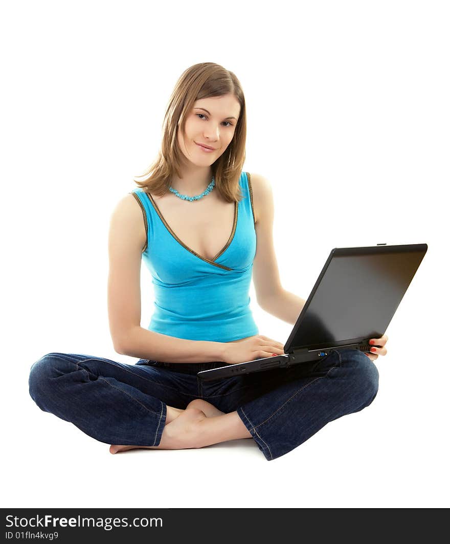 Smiling girl working on laptop; isolated on white. Smiling girl working on laptop; isolated on white.