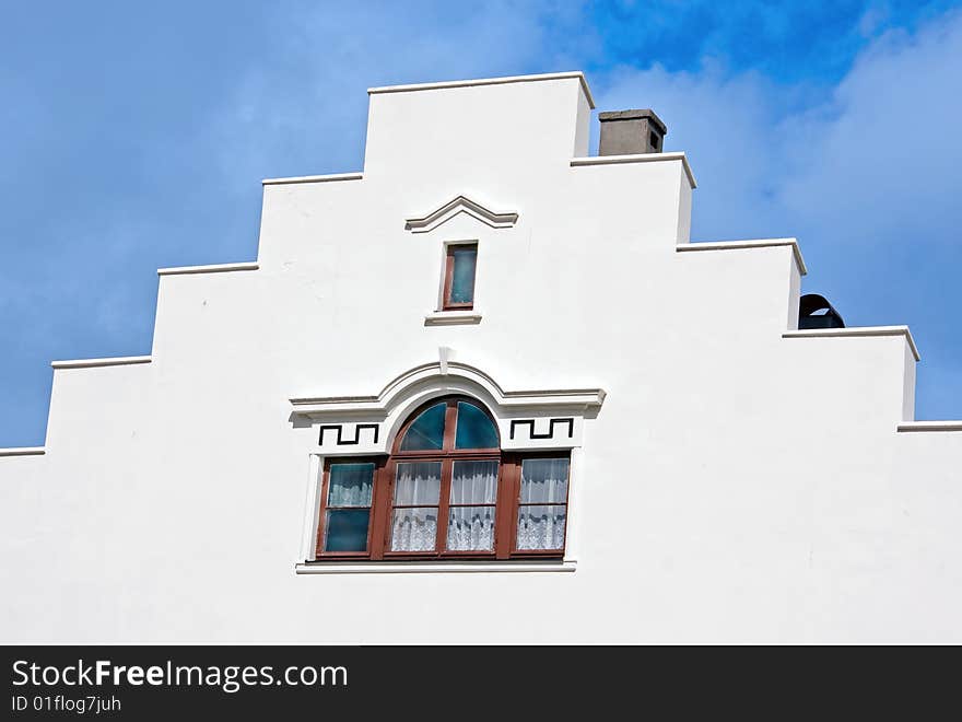 White building with windows and stairs