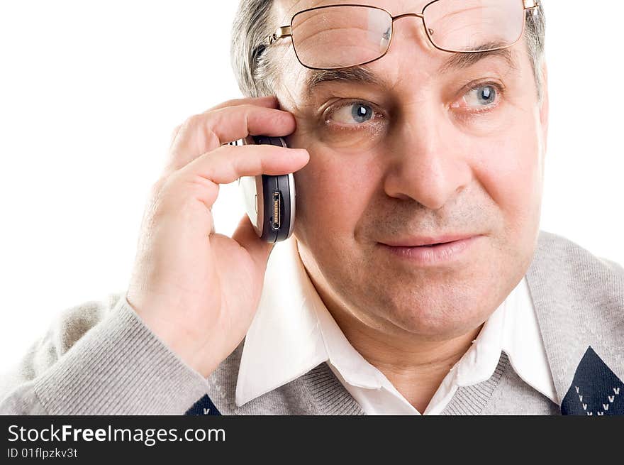 Senior man talking on mobile phone (isolated on white)