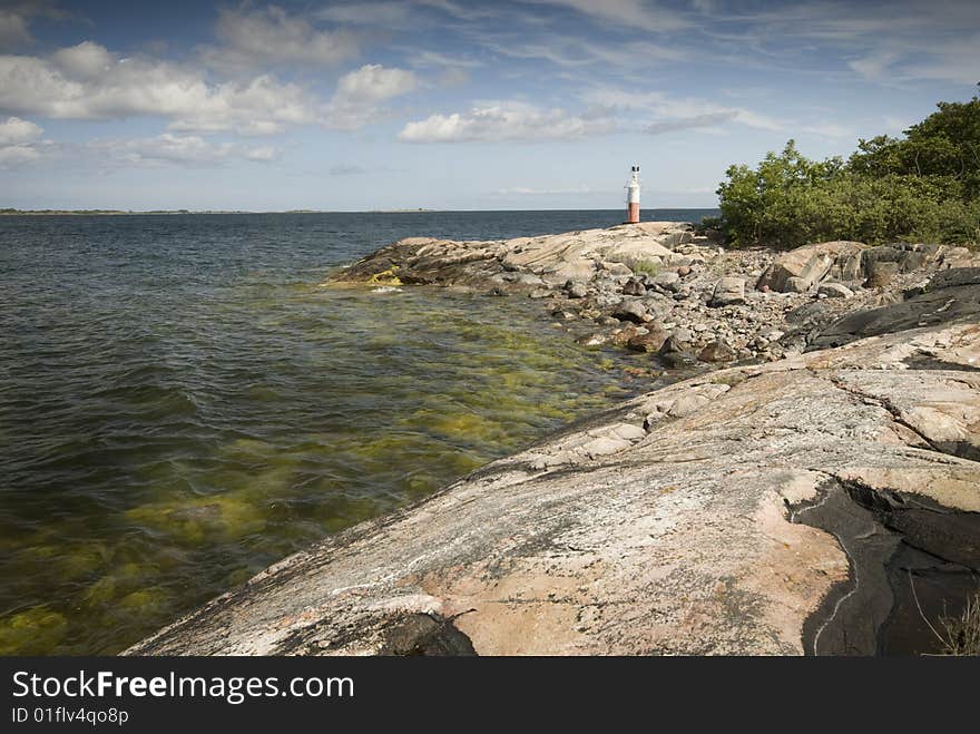 Rocky cost with a lighthouse