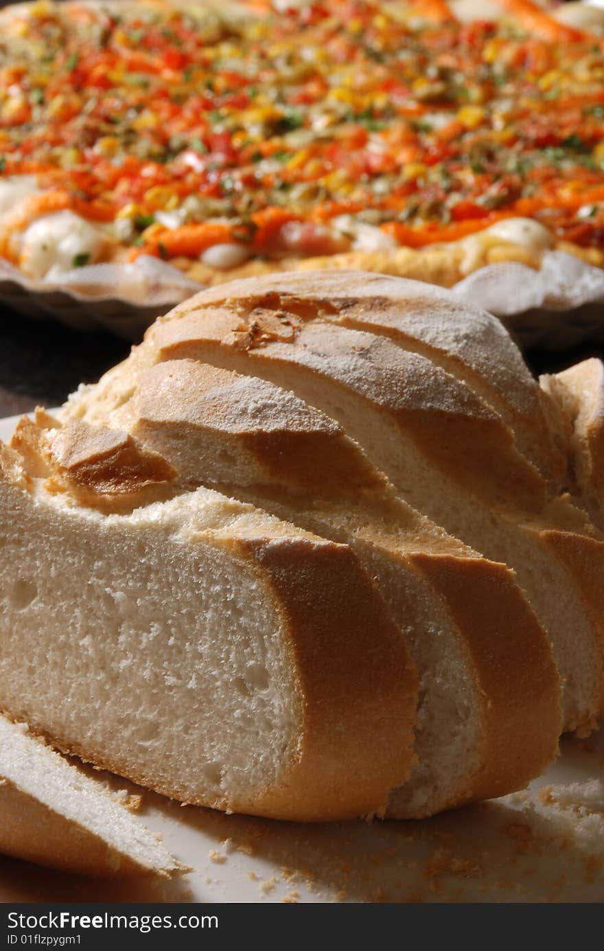 Food. cut loaf of bread over table. Food. cut loaf of bread over table