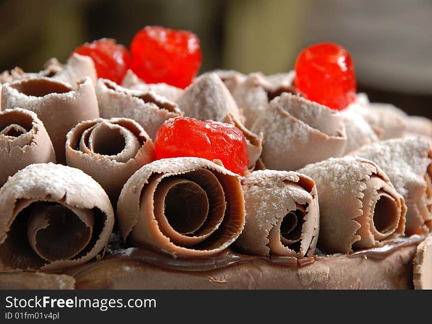 Cake with cherries and chocolate sugar, cherries