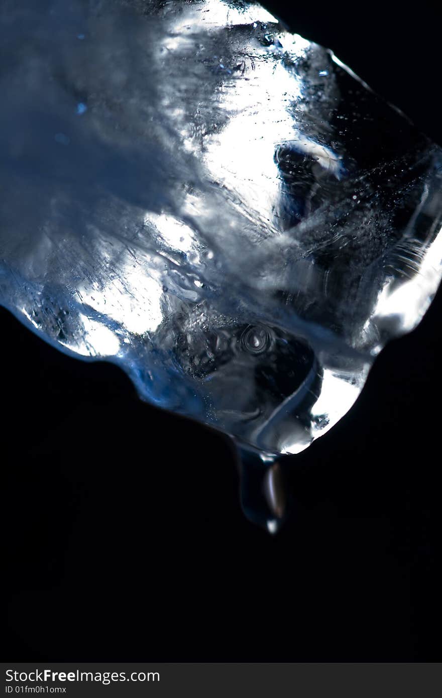 Macro photo of Ice cube with drop