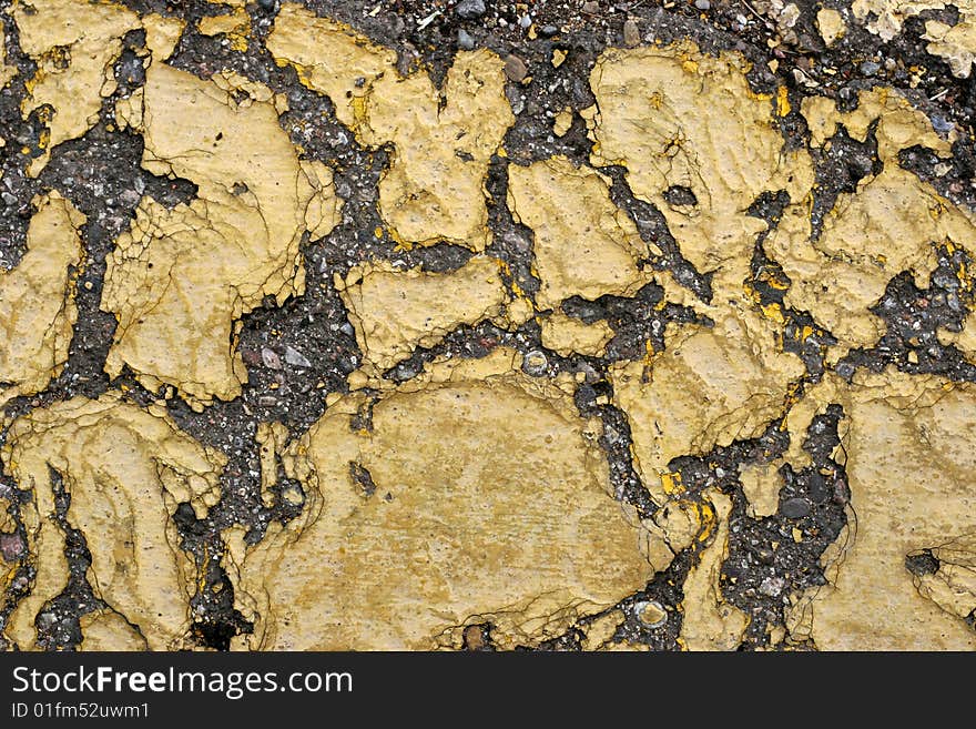 Abstract background of cracking yellow paint on asphalt. Abstract background of cracking yellow paint on asphalt.