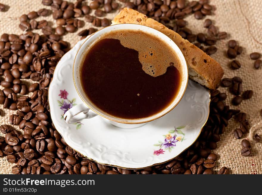 Cup of coffee and biscotti cookie