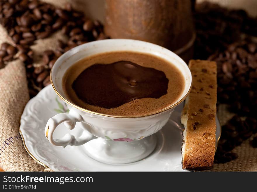 Cup of coffee and biscotti cookie