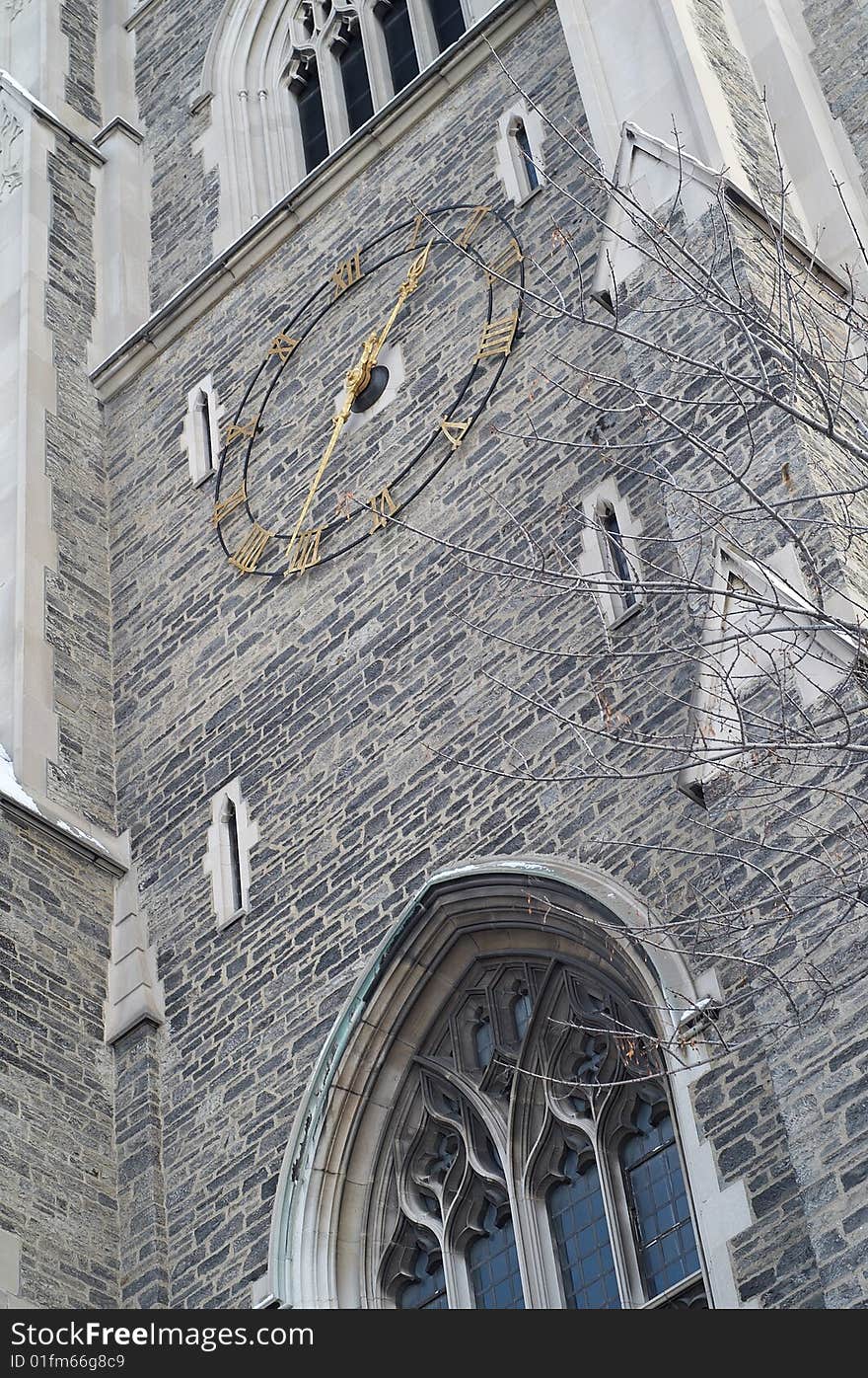 Clock on the tower's wall. Clock on the tower's wall