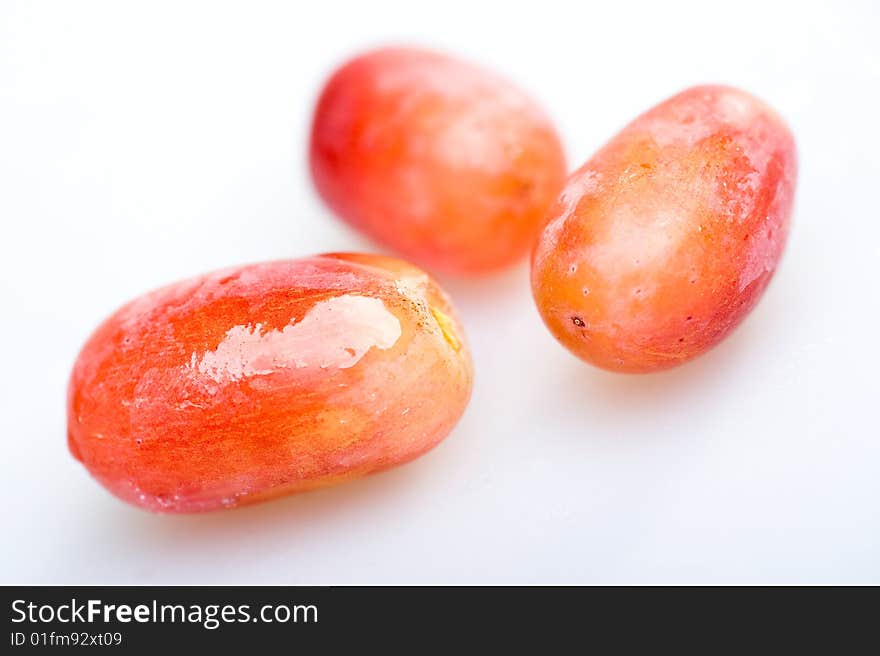 Three Red Grapes on white background