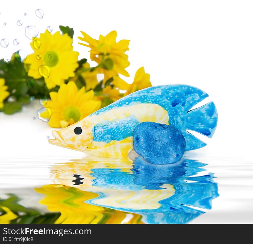 Summer Holidays - fish with water bubbles and blue pebbles on the beach. Ocean reflections included. Summer Holidays - fish with water bubbles and blue pebbles on the beach. Ocean reflections included.