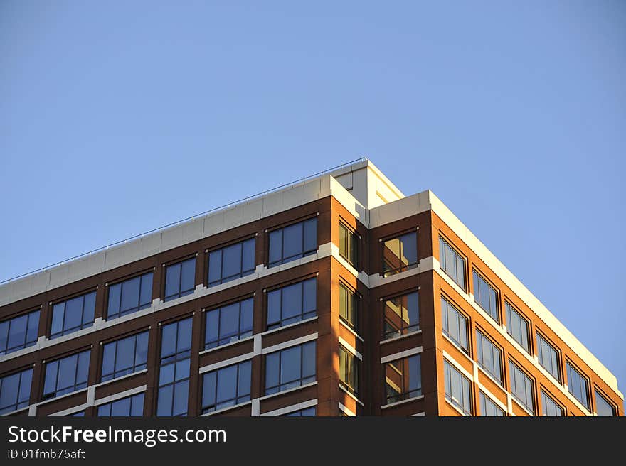 The corner of a building with an orange-colored brick exterior. The corner of a building with an orange-colored brick exterior.