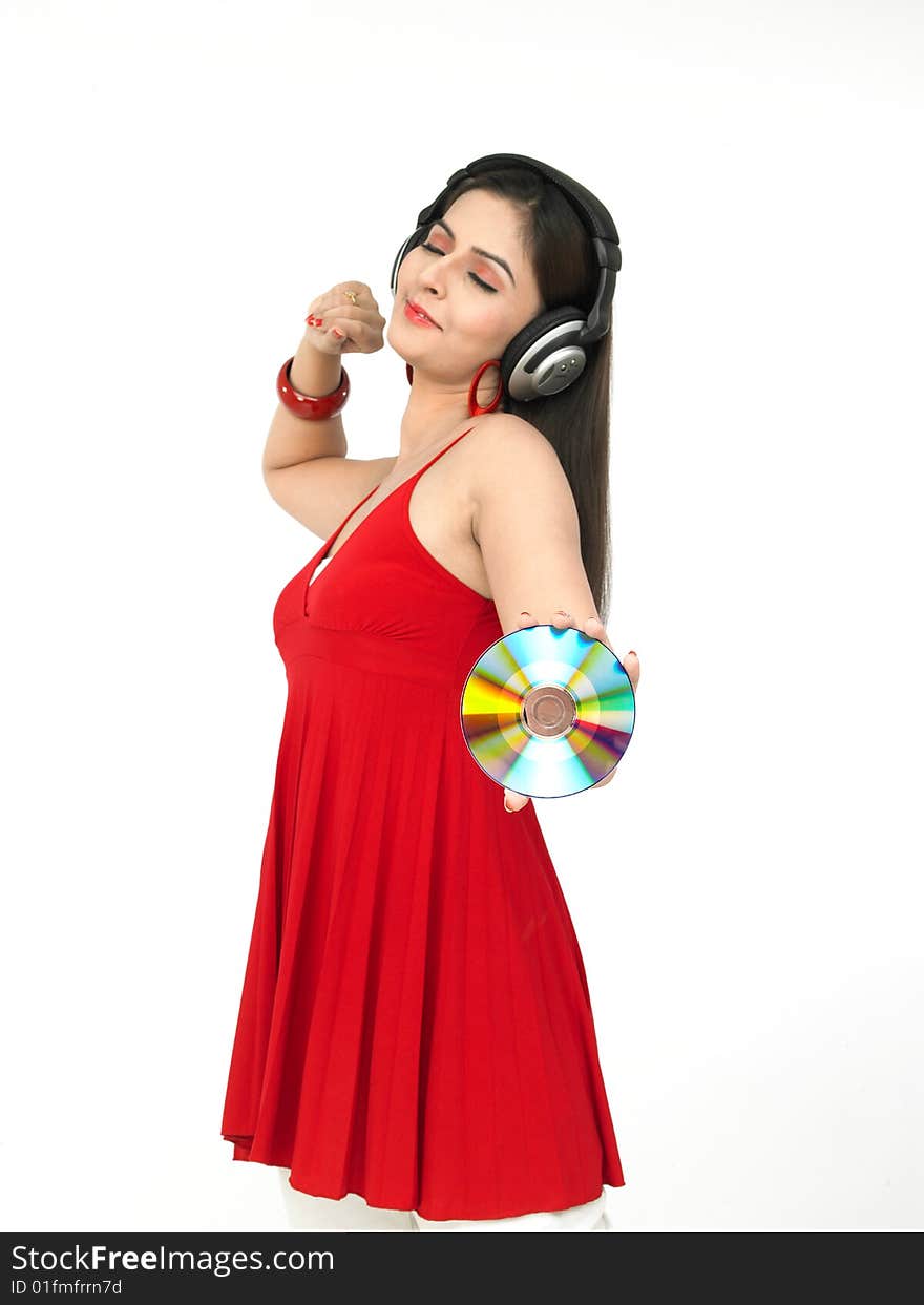 Asian woman wearing a headhphone enjoying music