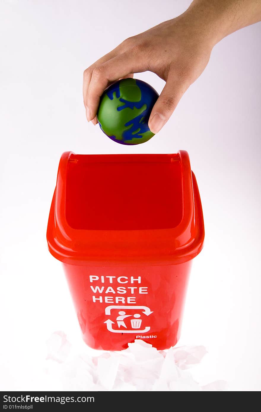 Hand take hold of his globe chuck recycling bin. Hand take hold of his globe chuck recycling bin