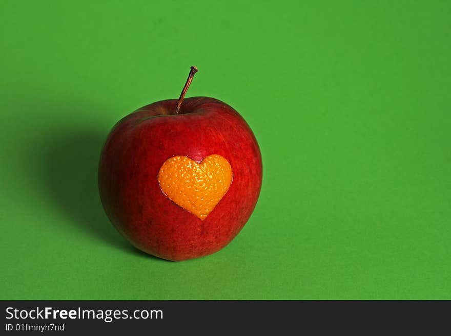 Apple with heart of orange. Apple with heart of orange