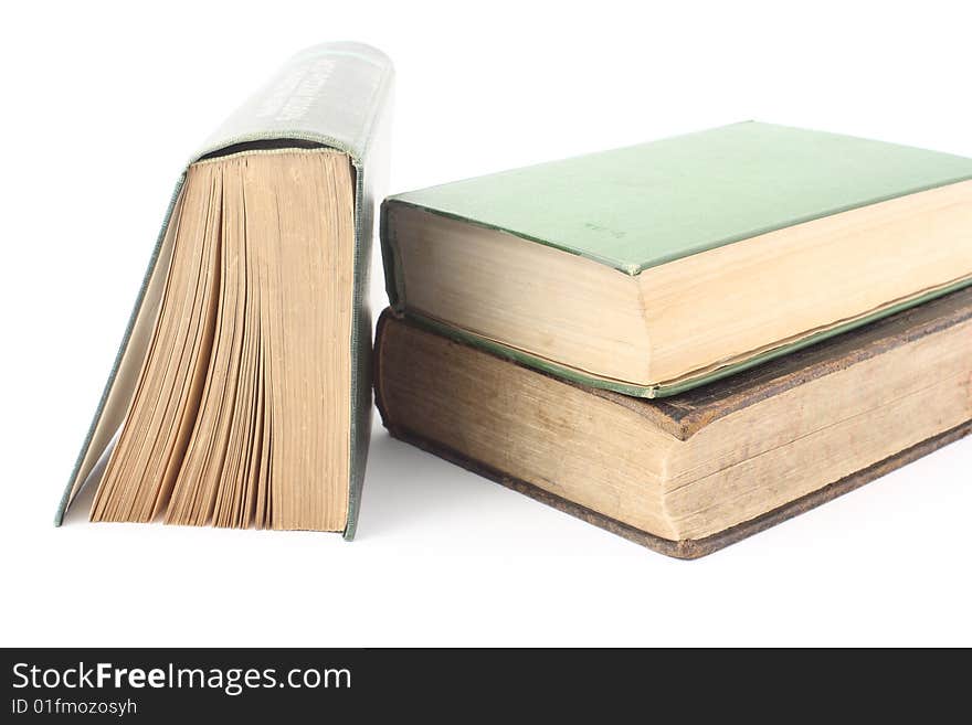 Three old books on a white background