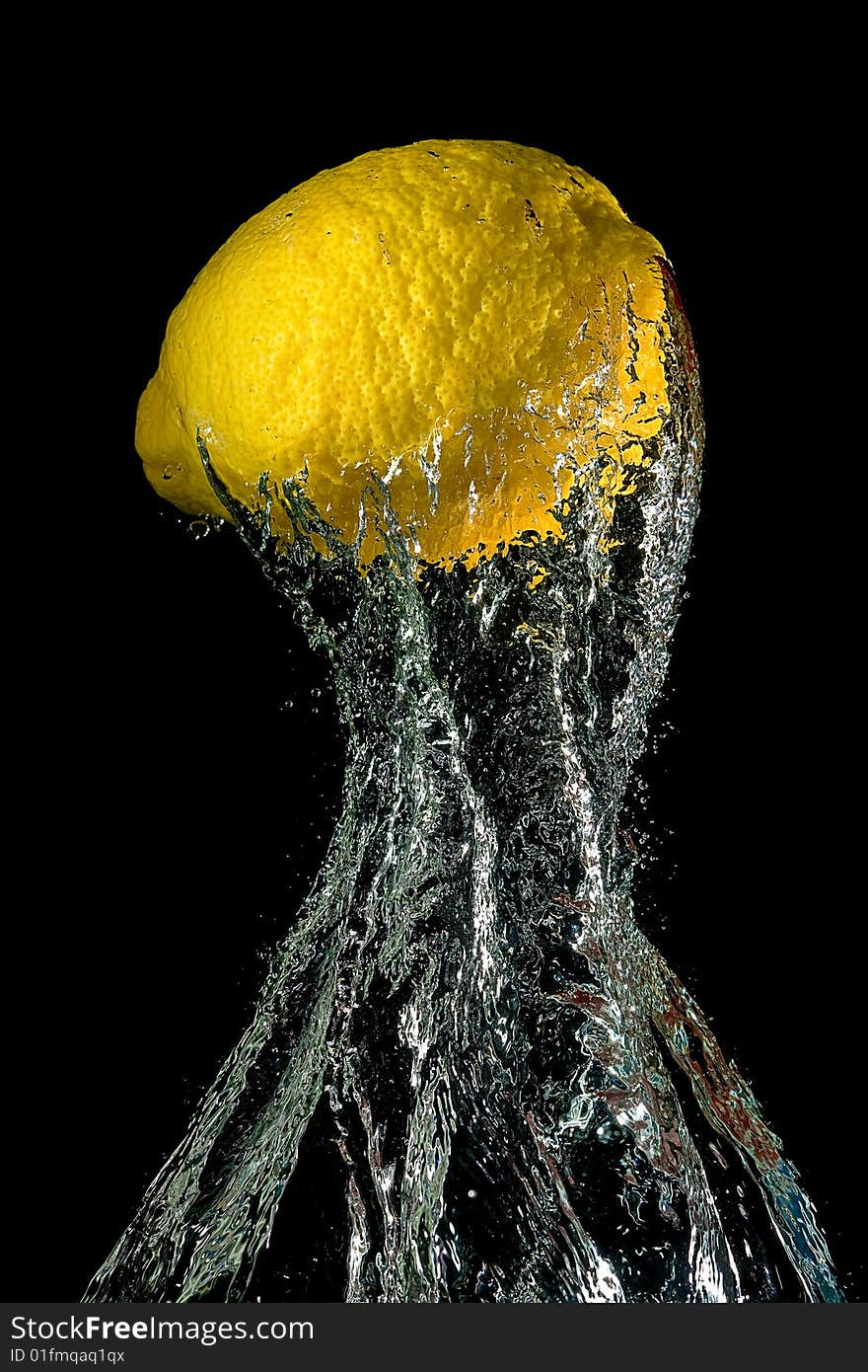 Lemon in water splashes on a black background