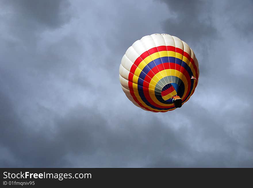 A coloured balloon is flying inside dangerous storm clouds ... Italy-caripneti (RE). A coloured balloon is flying inside dangerous storm clouds ... Italy-caripneti (RE).