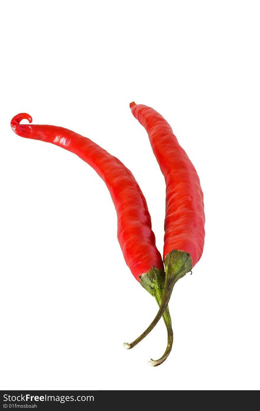 Two red hot chillis against a white background. Two red hot chillis against a white background