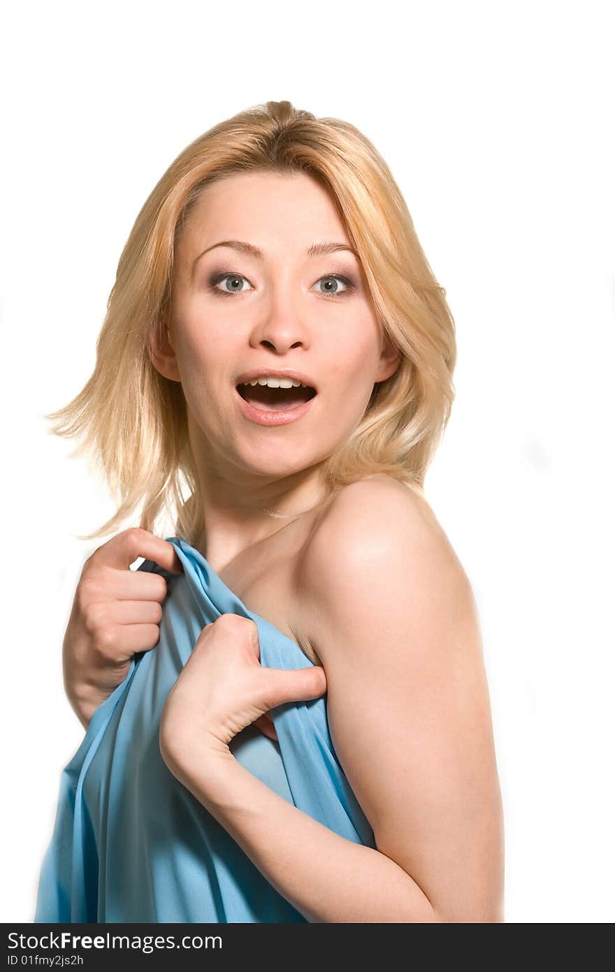 Surprised woman behind blue fabric