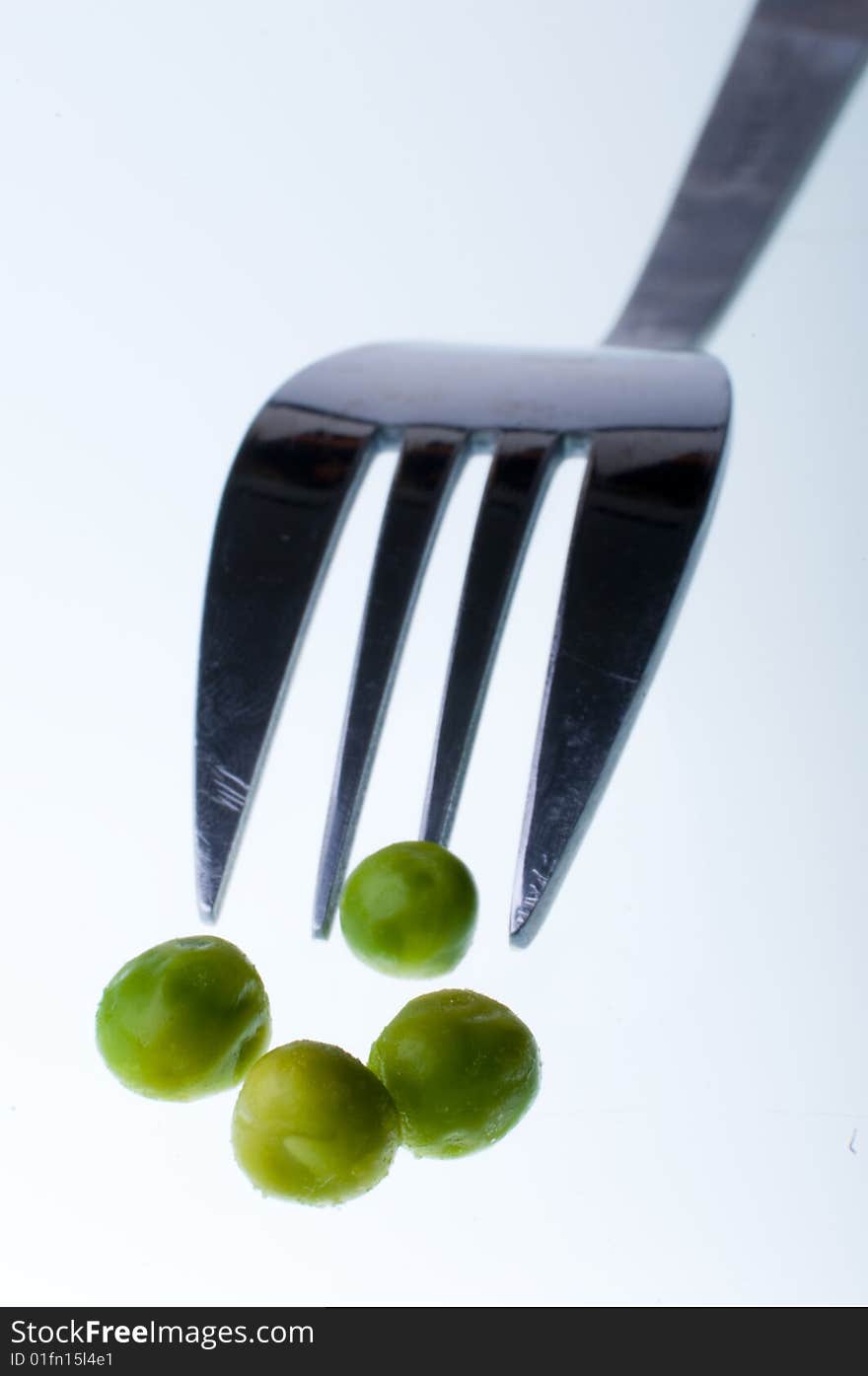 Green peas with fork background. Green peas with fork background