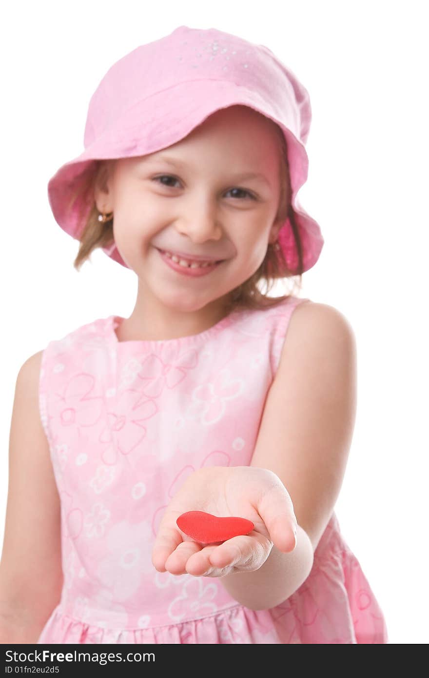 Girl holds a red heart in an outstretched arm. Girl holds a red heart in an outstretched arm