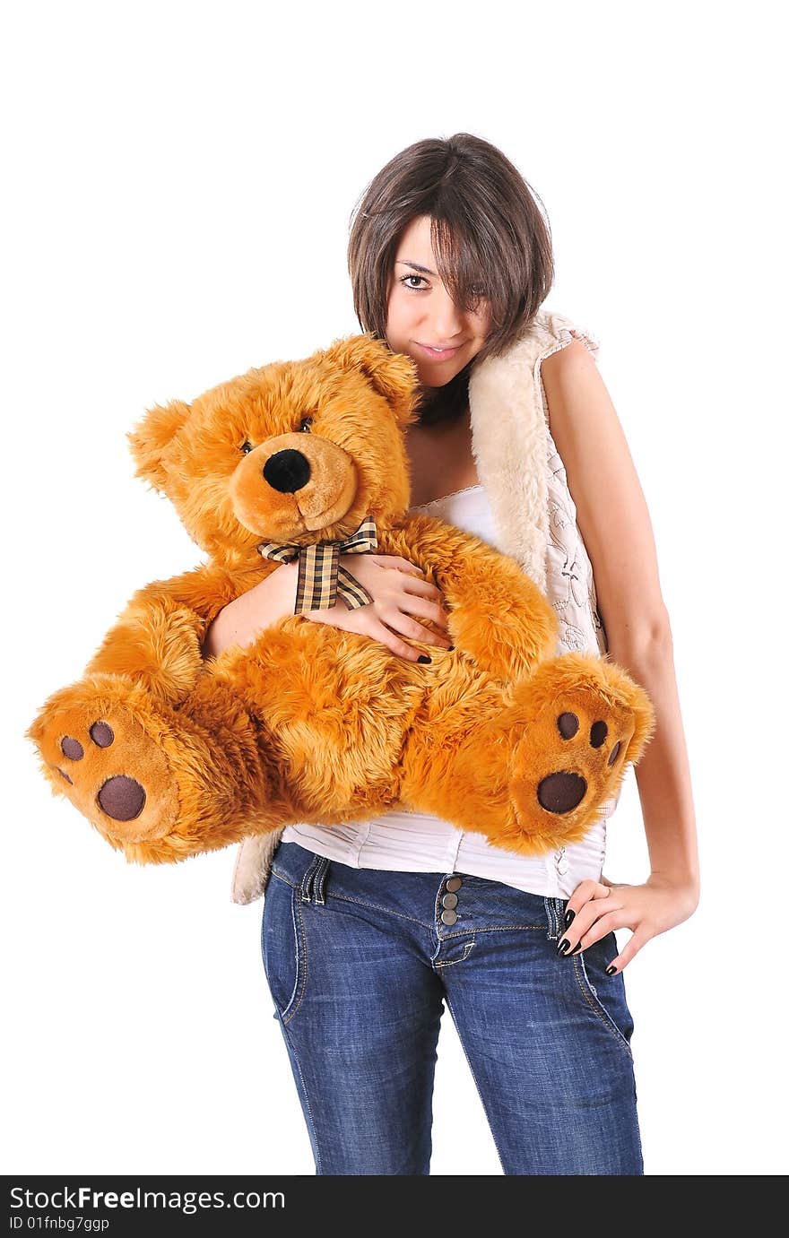 Girl hugging a Teddy bear on white background. Girl hugging a Teddy bear on white background