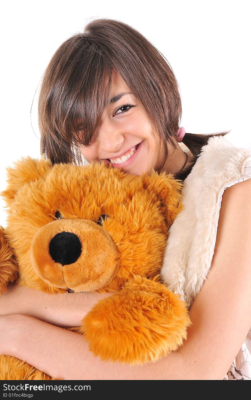 Girl hugging a Teddy bear on white background. Girl hugging a Teddy bear on white background