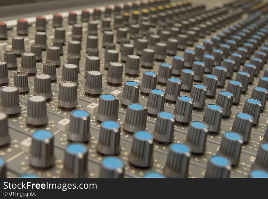 Closeup of knobs of a sound mixer. Closeup of knobs of a sound mixer.