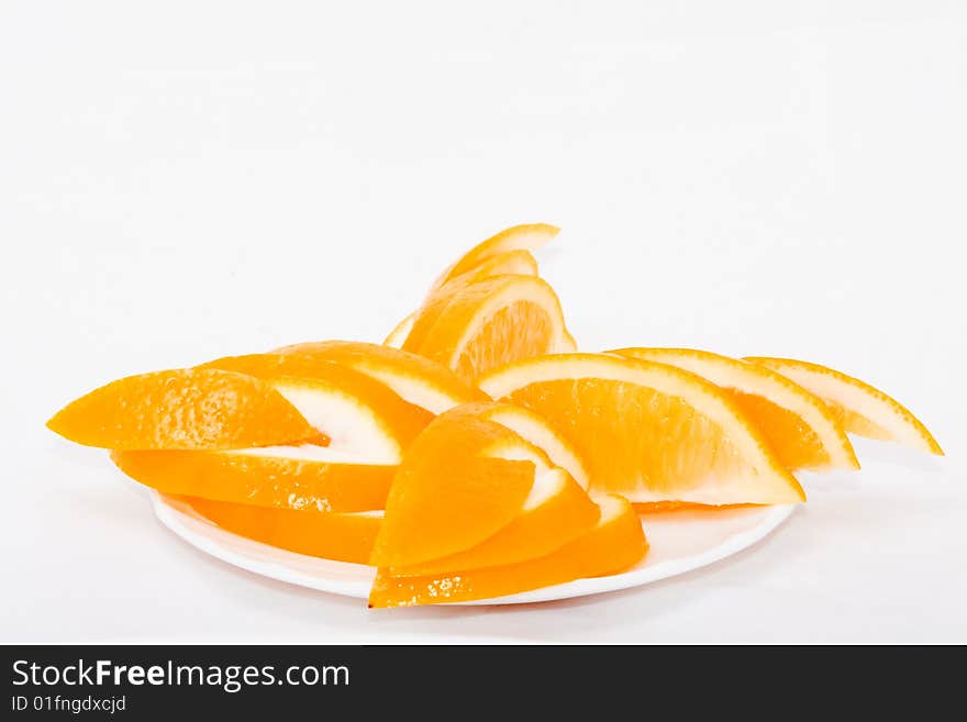 One lemon is on the plate and tray. One lemon is on the plate and tray