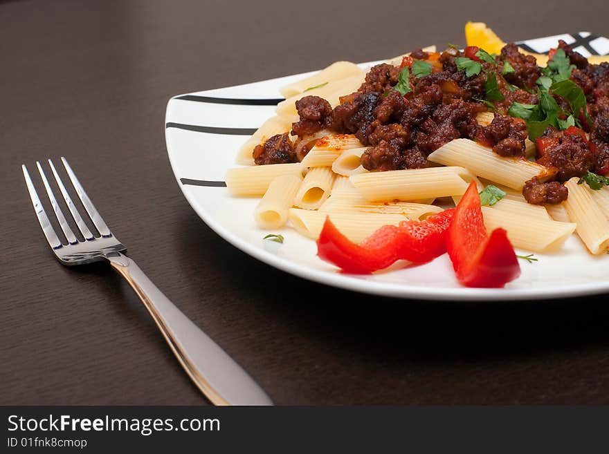 A large platter with cutlet and pasta. A large platter with cutlet and pasta