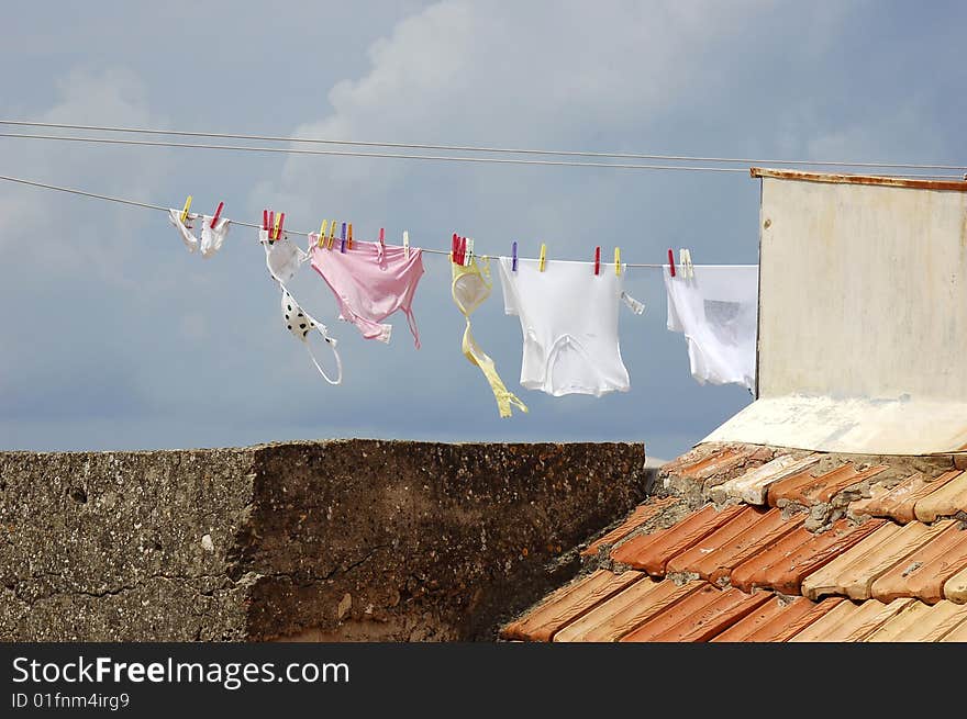 Drying clothes in the sun up on the roof. Drying clothes in the sun up on the roof