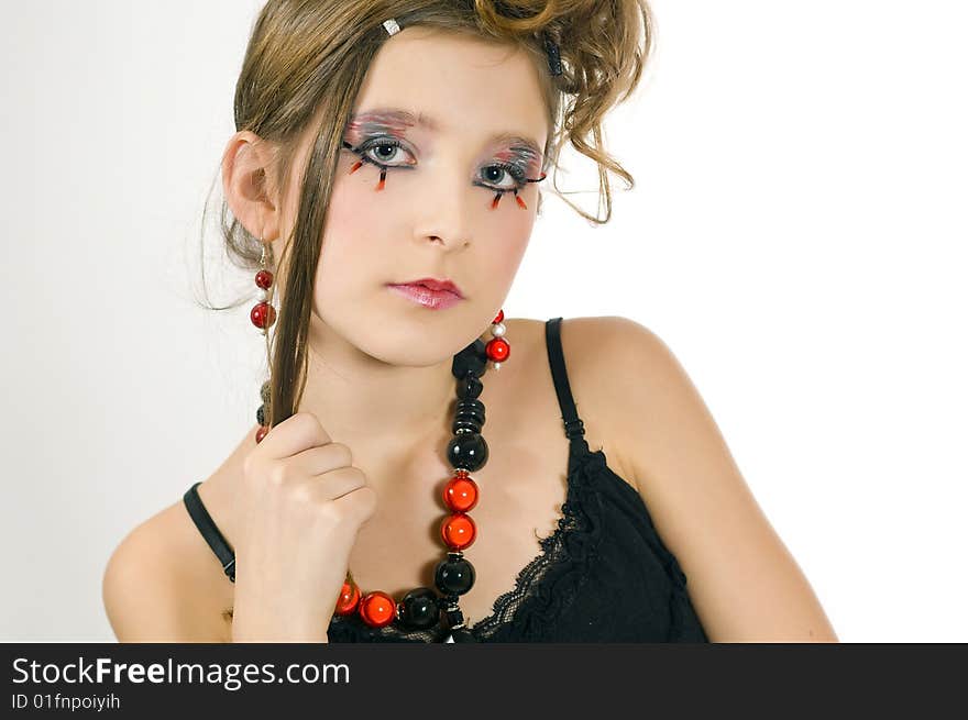 Young fashion girl with special eye makeup, jewelry and black top