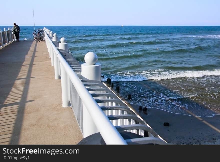 View on a large pier at the Baltic sea coast. View on a large pier at the Baltic sea coast