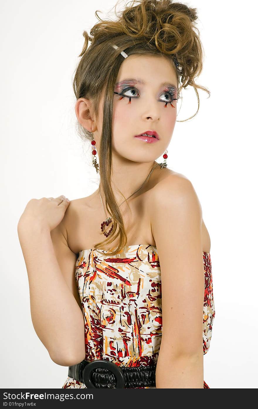 Closeup of young fashion girl with special eye makeup wearing colored top and black belt