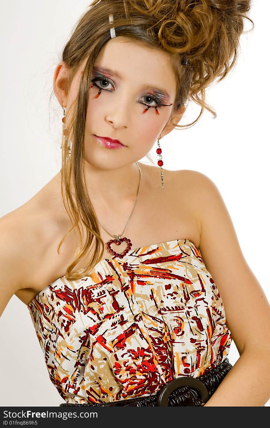 Closeup of young fashion girl with special eye makeup wearing colored top and black belt