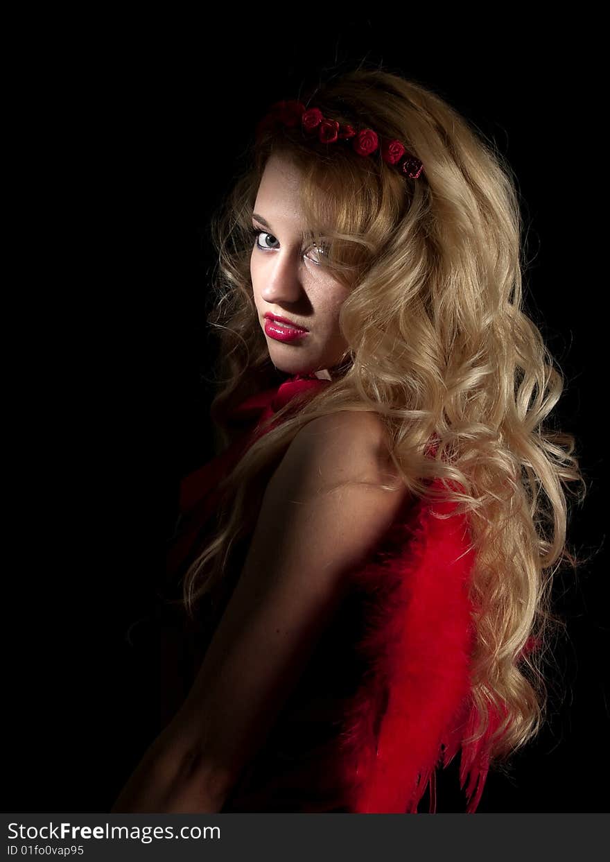 Beautiful teen lady in angel dress on black background. Beautiful teen lady in angel dress on black background