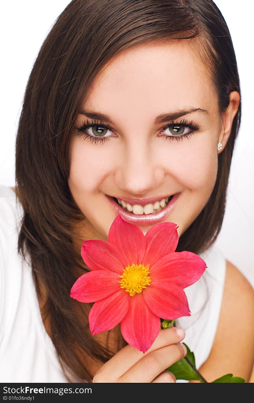 Young beautiful brunette with flower close up shoot