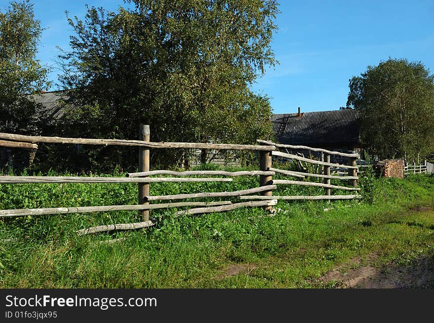 View of pole fence in northern russian village. View of pole fence in northern russian village