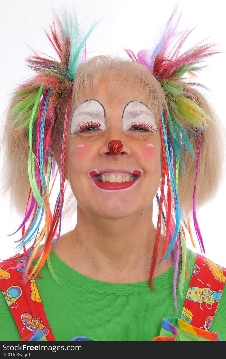 Clown's portrait smiling with colorful hair