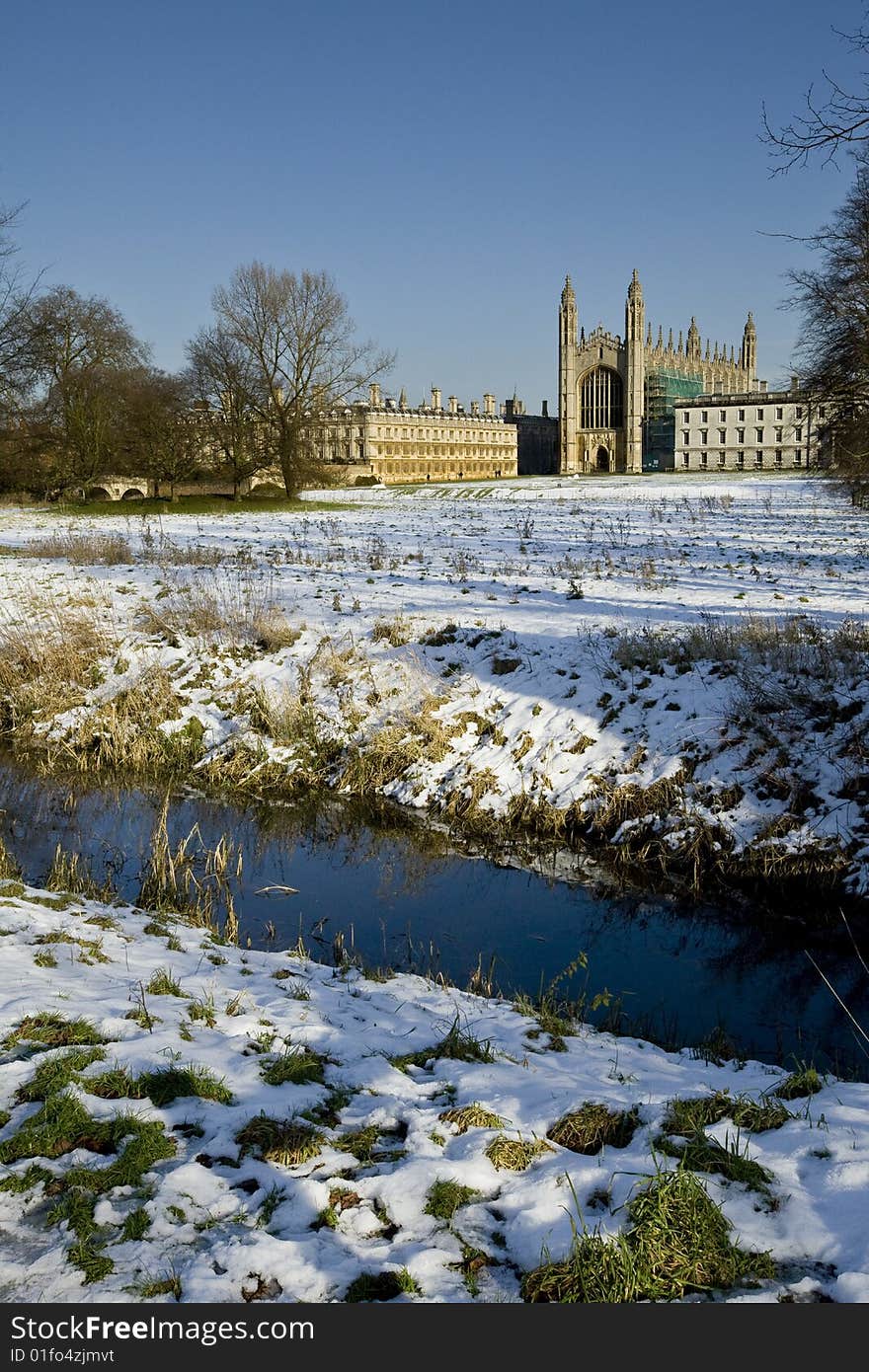 Kings College Chapel Cambridge in the winter bathed in sunlight with snow on the ground. Kings College Chapel Cambridge in the winter bathed in sunlight with snow on the ground