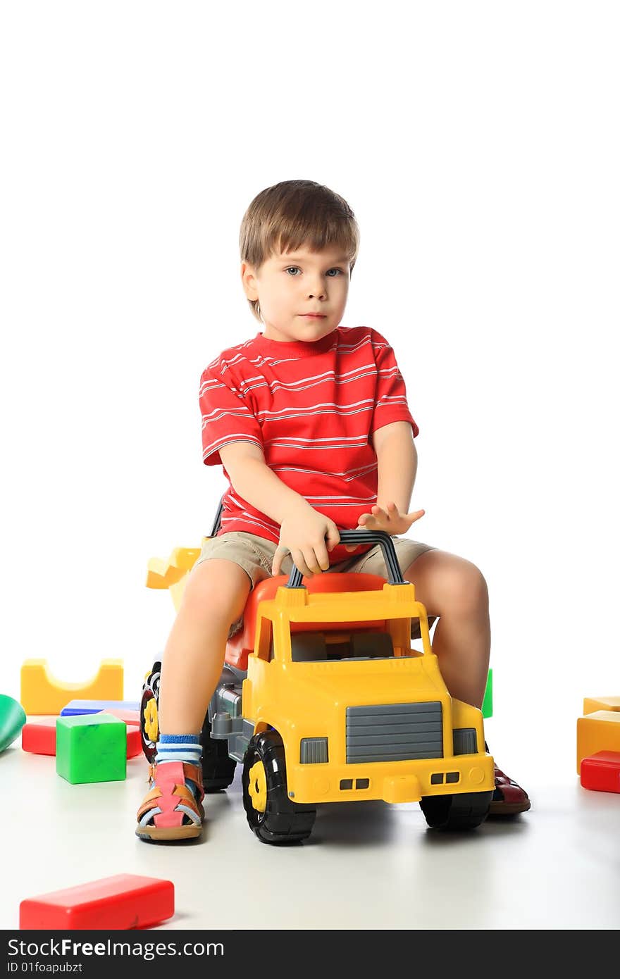 Beautiful child enjoying his game. Shot in a studio. Beautiful child enjoying his game. Shot in a studio.