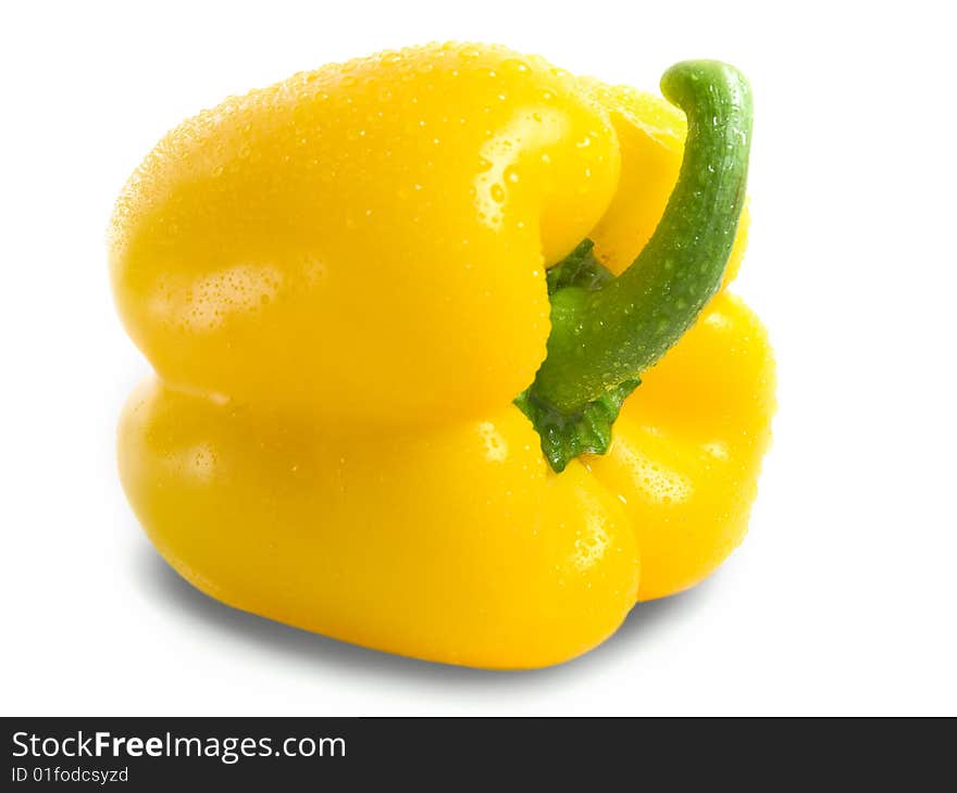 Yellow pepper isolated on white closeup. water drops