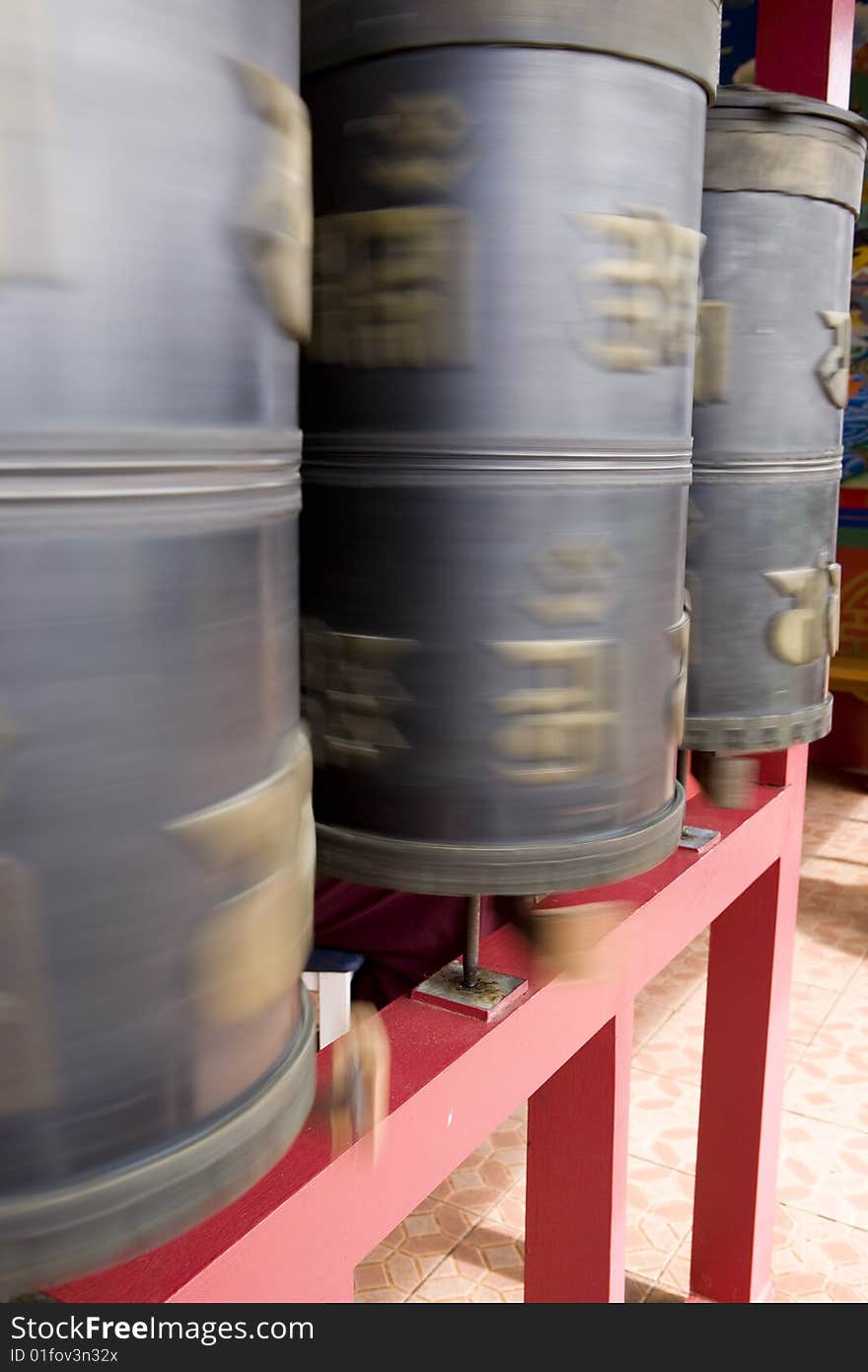 Tibetan prayer wheels moving to make pray