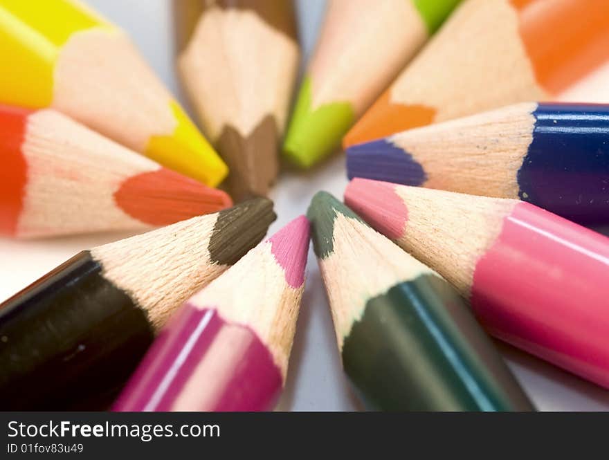 Colored pencil crayons on white background