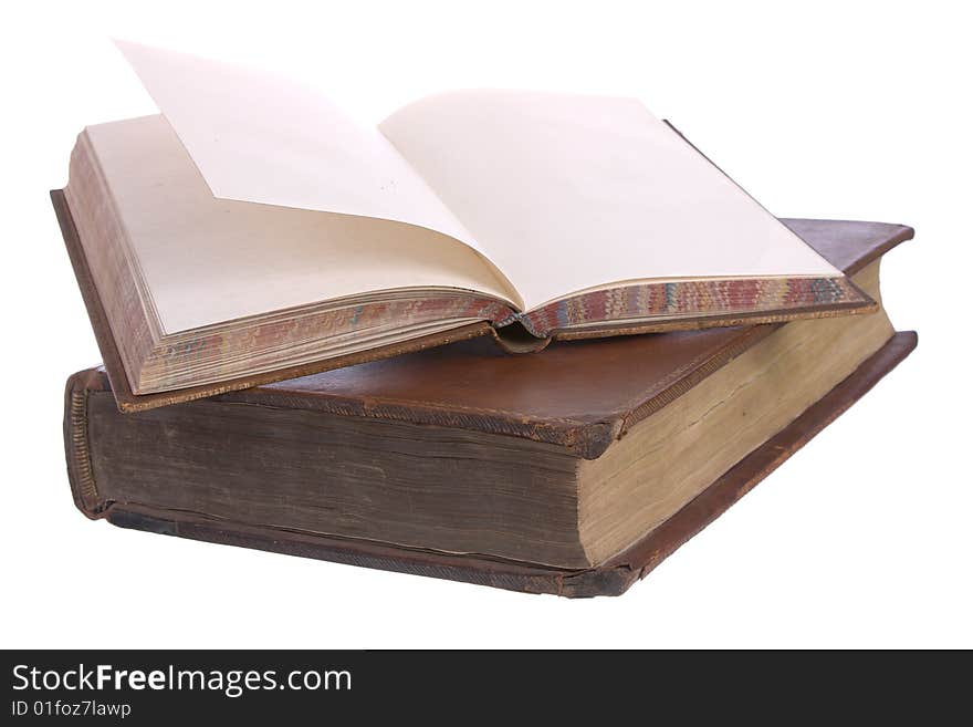 A pile of old leather bound books isolated on a white background