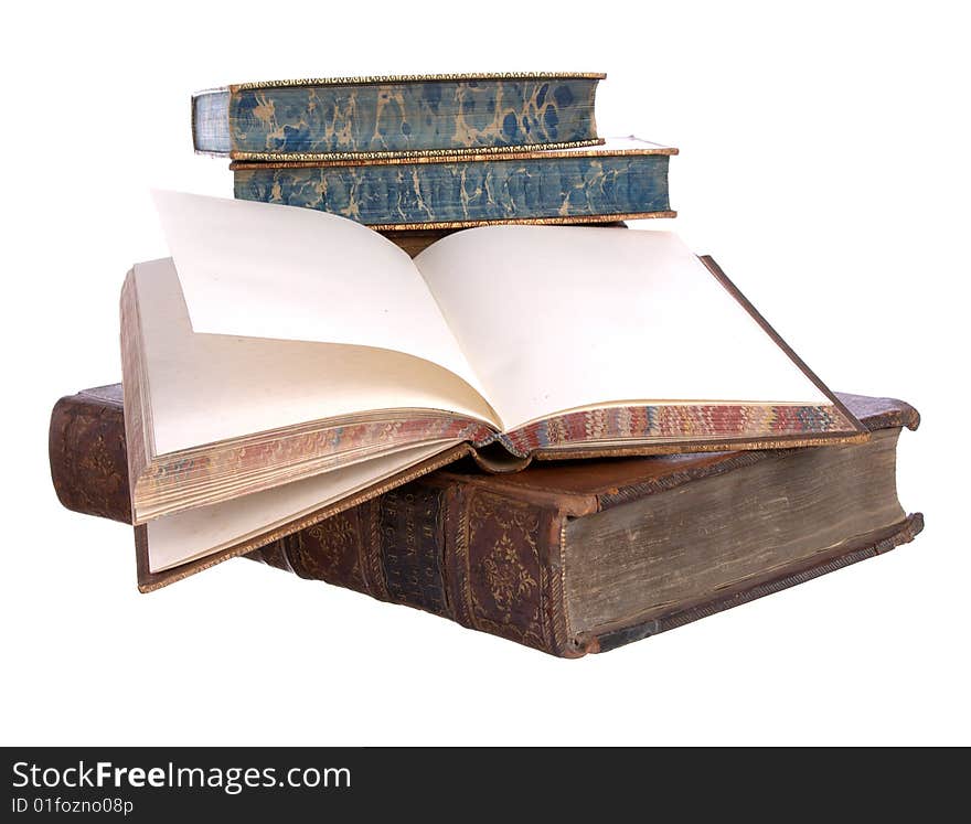 A pile of old leather bound books isolated on a white background