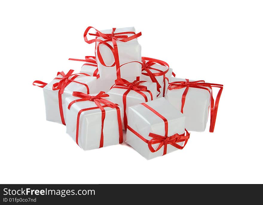 White presents with red ribbon on white background