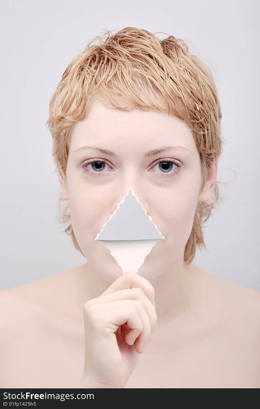 Portrait of the young woman with tongue from paper