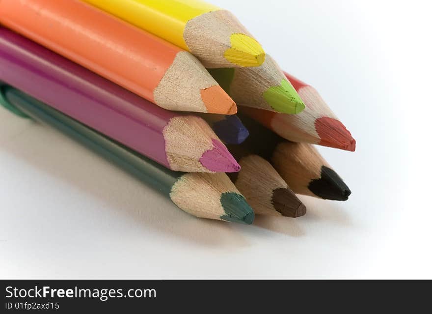 Colored pencil crayons on white background