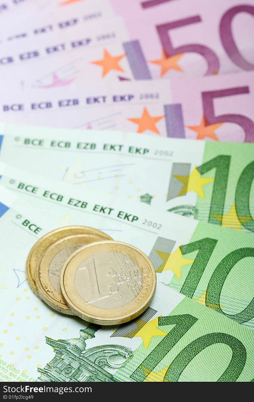 Euro banknotes with various coins, can be used as a background